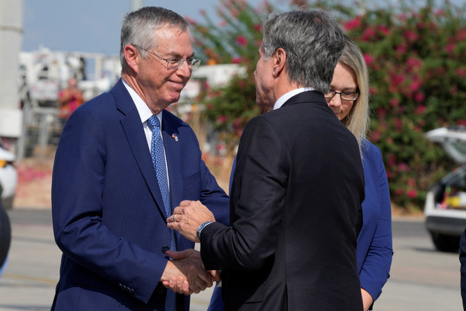 Ambassador to US Michael Herzog welcomes Secretary of State Antony Blinken upon his arrival at Ben Gurion Airport in Tel Aviv, Israel, on Oct. 12, 2023. (Pool via REUTERS)