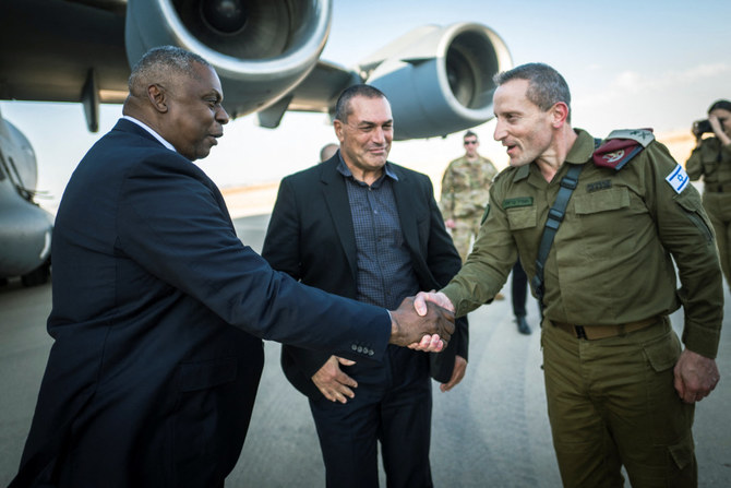 US Secretary of Defense Lloyd Austin is welcomed by Israeli defense officials upon his arrival in Tel Aviv on Oct. 13, 2023. (REUTERS)