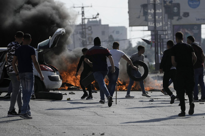 Palestinian demonstrators clash with Israeli forces following a demonstration in support of the Gaza Strip, in the West Bank city of Nablus, on Oct. 13, 2023. (AP Photo/Majdi Mohammed)