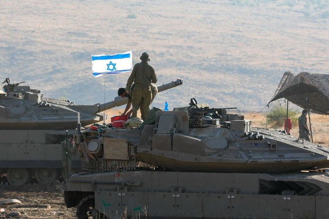 Israeli Merkava tanks are positioned in the north of Israel near the border with Lebanon on October 15, 2023. (AFP)