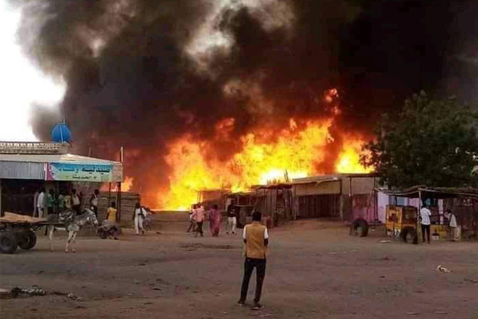 Above, fire rages in a livestock market area in Al-Fasher, the capital of Sudan’s North Darfur state on Sept. 1, 2023. (AFP)