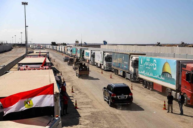 Egyptian army vehicles and a security detail escort the vehicle carrying the United Nations Secretary-General near the gate of the Egyptian side of the Rafah border crossing with the Gaza Strip in the east of North Sinai province on October 20, 2023. (AFP)