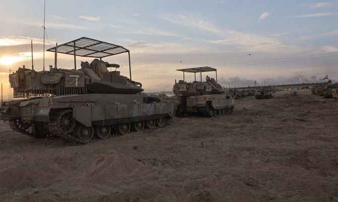 Israeli troops gather near the border with Gaza before entering the Palestinian strip on October 29, 2023, amid ongoing battles between Israel and the Palestinian Hamas movement. (AFP)
