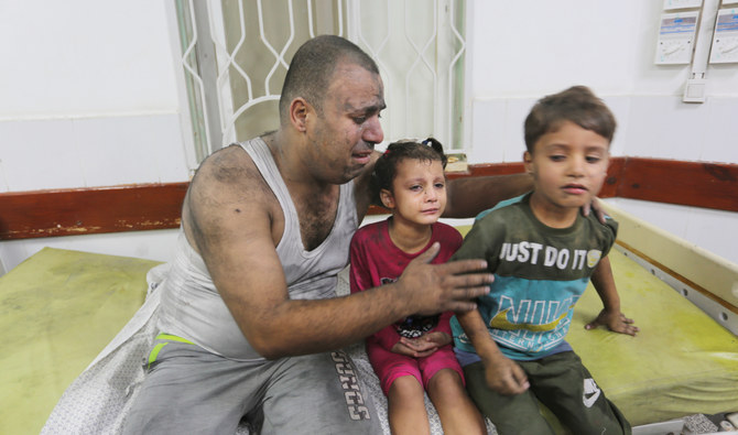 Palestinians wounded in an Israeli strike on the Gaza Strip wait for treatment in a hospital in Rafah on Monday. Concern has surged about the fate of hospitals in the war zone. (AP)