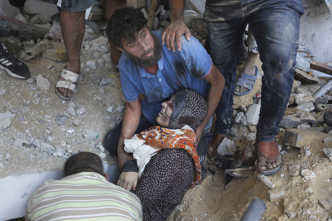 Palestinians evacuate survivors of the Israeli bombardment of the Gaza Strip in Rafah on Oct. 30, 2023. (AP)