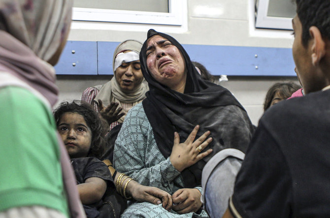Wounded Palestinians at the Al-Shifa hospital, following Israeli airstrikes, in Gaza City, Oct. 17, 2023. (AP)