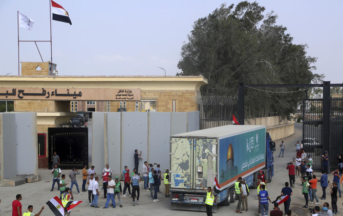 A truck carrying humanitarian aid for the Gaza Strip crosses the Rafah border gate in Rafah (AP)