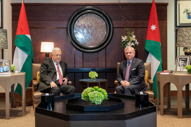 Jordan's King Abdullah II meets with Palestinian President Mahmoud Abbas in Amman, Jordan October 12, 2023. (Reuters)