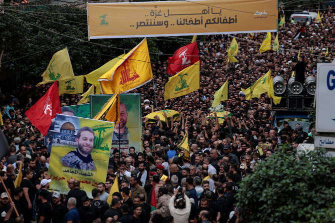 Hezbollah fighters killed in clashes with Israeli troops in Lebanon are carried to their graves on Oct. 27, 2023. (Reuters)