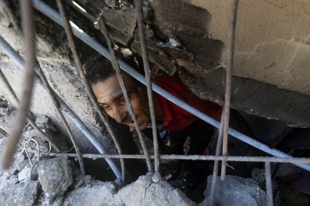 Palestinians look for survivors under the rubble of a destroyed building following an Israeli airstrike in Khan Younis refugee camp, southern Gaza Strip on Nov. 6, 2023. Entire generations of Palestinian families in the besieged Gaza Strip have been killed in airstrikes in the ongoing Hamas-Israel war. They include infants to elderly grandparents, killed in attacks the Israeli army says aim to root out the militant group from the densely populated coastal territory. (AP Photo/Mohammed Dahman, File)