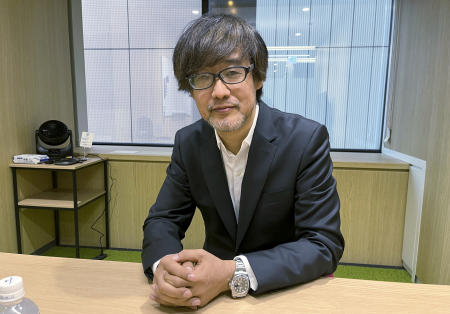 Takashi Yamazaki, director of the new Godzilla film, speaks with The Associated Press at the film studio Toho headquarters office in Tokyo Wednesday, Nov. 1, 2023. (AP)