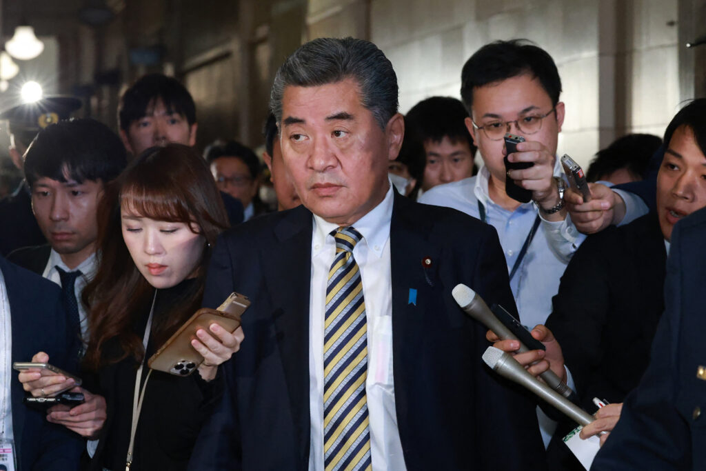 Kenji Kanda, state minister of finance in charge of government bonds and monetary policy, told reporters he had resigned because he did not want the issue to disrupt debate in parliament. (AFP)
