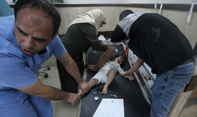 Palestinian child wounded in the Israeli bombardment of the Gaza Strip is treated in Al Aqsa Hospital in Deir Al Balah on Tuesday, Oct. 31, 2023. (AP)