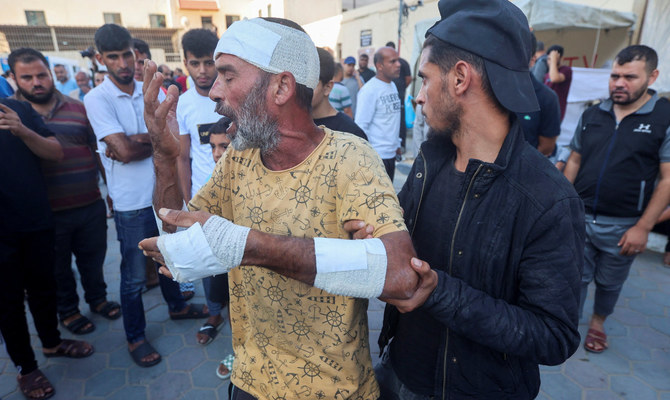 A Palestinian man, who was wounded in an Israeli strike and said that he lost his father, son and brother in the strike, reacts at Shuhada Al-Aqsa hospital in the central Gaza Strip October 31, 2023. (Reuters)