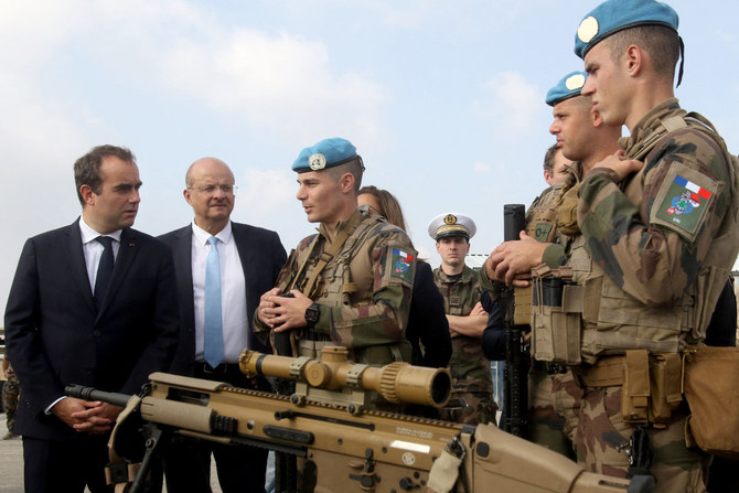 French Defense Minister Sebastien Lecornu (L) visits the base of the French contingent of the United Nations Interim Forces in Lebanon (UNIFIL) in the southern Lebanese village of Deir Kifa on November 2, 2023. (AFP)