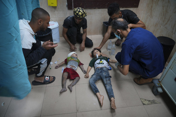 Palestinian children wounded in an Israeli bombardment are brought to a hospital in Deir al Balah, south of the Gaza Strip, on Nov. 2, 2023. (AP Photo/Hatem Moussa)