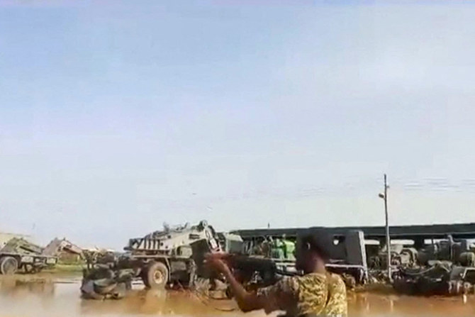 A grab from a UGC video posted on the X platform on August 22, 2023 reportedly shows members of the Sudanese army firing at Rapid Support Forces (RSF) fighters in what they say is the al-Shajara military base in Khartoum. (AFP/File)