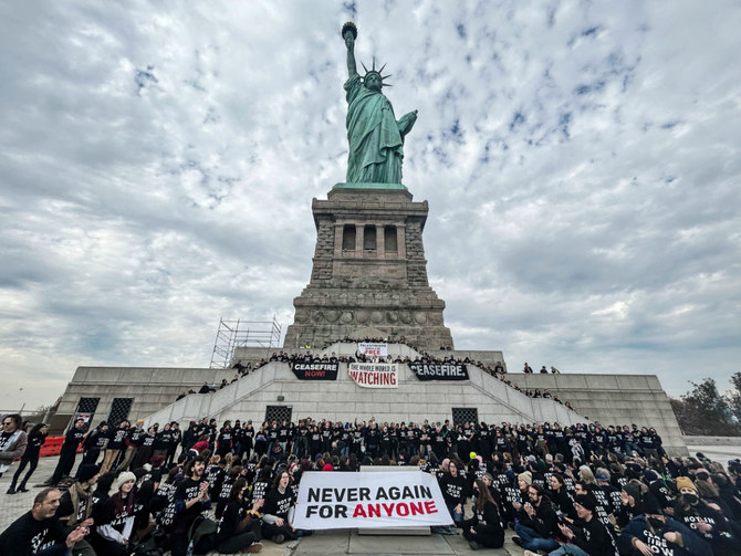 Activists from Jewish Voice for Peace occupy the pedestal of the Statue of Liberty on November 6, 2023 in New York City. (AFP)