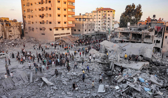 People search rubble for survivors and the bodies of victims in the aftermath of Israeli bombardment in Rafah in the southern Gaza Strip on November 6, 2023, amid continuing battles between Israel and the Palestinian militant group Hamas. (AFP)