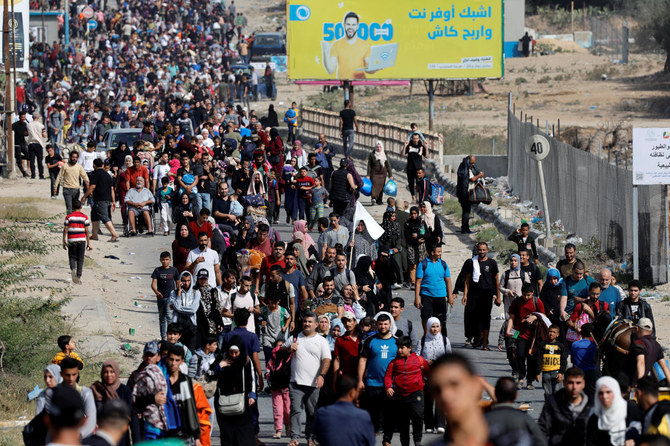 Palestinians fleeing north Gaza walk towards the south, amid the ongoing conflict between Israel and Palestinian Islamist group Hamas, in the central Gaza Strip, on Nov. 9, 2023. (Reuters)