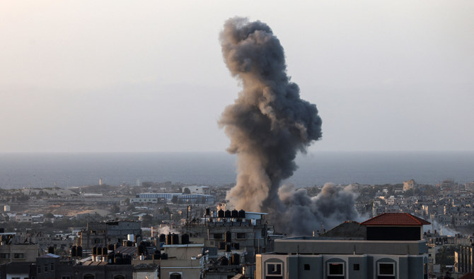 A plume of smoke rises over Rafah in the southern Gaza Strip during an Israeli strike on November 9, 2023, amid ongoing battles between Israel and the Palestinian Hamas movement. (AFP)