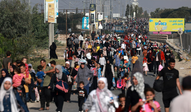 Palestinians fleeing Gaza City walk amid the ongoing battles between Israel and Hamas. (AFP)