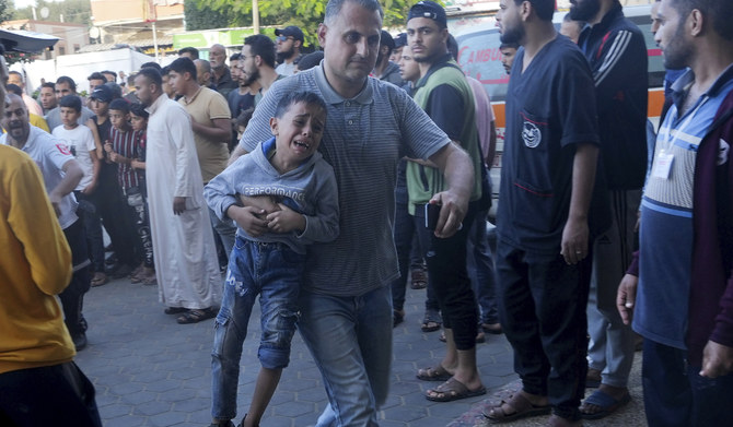 Palestinians wounded in the Israeli bombardment of the Gaza Strip are brought to a treatment room of al Aqsa Hospital on Deir al Balah, Gaza Strip, Friday, Nov. 10, 2023. (AP)