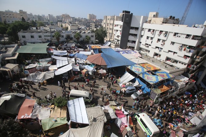 Displaced Palestinian families have set up makeshift tents outside Al-Shafaa. (AFP/File)