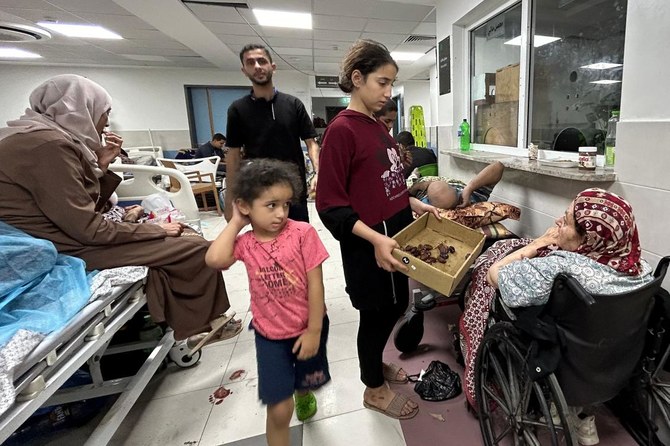 Patients and internally displaced people are pictured at Al-Shifa hospital in Gaza City on November 10, 2023, amid ongoing battles between Israel and the Palestinian Hamas movement. (AFP)