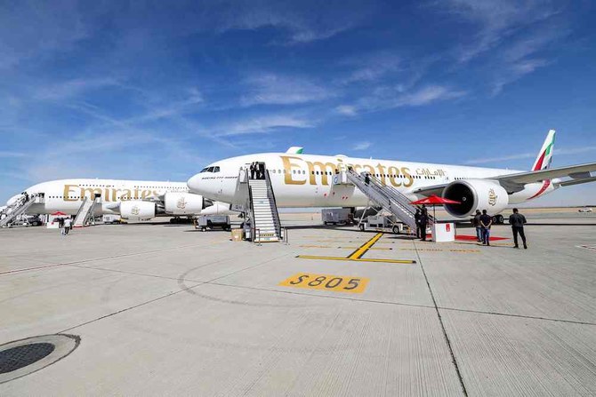 Global aviation is booming after the coronavirus pandemic saw worldwide lockdowns and aircraft grounded. Above, an Emirates Boeing 777-300ER, right, and an Airbus A380-800 aircraft on static display during the Dubai Airshow on Nov. 13, 2023. (AFP)