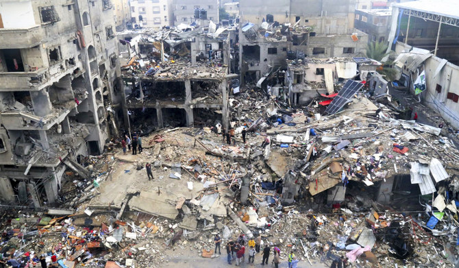 Palestinians look for survivors after an Israeli strike on a building last night in Jebaliya refugee camp, Gaza Strip, Tuesday, Nov. 14, 2023. (AP)