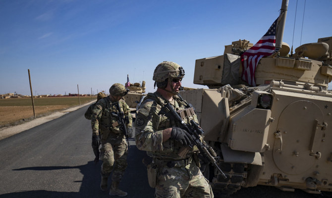 US troops patrol in the countryside of Syria's Hasakeh province near the Turkish border, on February 18, 2023. (AFP)