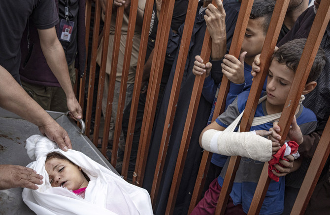 Palestinians mourn their relatives killed in the Israeli bombardment of the Gaza Strip, in the hospital in Khan Younis, Tuesday, Nov. 14, 2023. (AP)