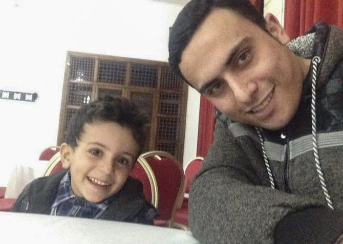 Above, Ahmed Al-Naouq in a selfie with his nephew Bakr, left, in Deir Al Balah, Gaza. Ahmed says 21 family members, including 13 children, were killed in an Israeli airstrike. (Courtesy of Ahmed Al-Naouq via AP)