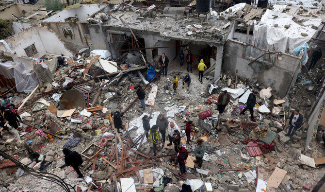Palestinians inspect the destruction following the Israeli bombardment of the Rafah refugee camp in the southern Gaza Strip on November 15, 2023. (AFP)