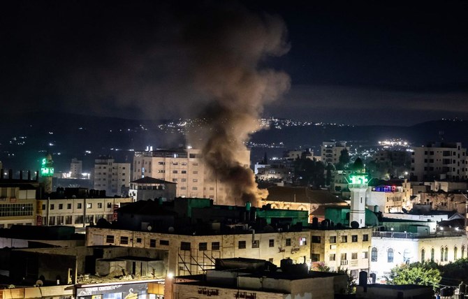 Smoke raises during a raid in the occupied West Bank Jenin refugee camp. In just over five weeks since the war between Israel and Hamas erupted on October 7, at least 190 Palestinians have been killed in the West Bank, according to the Palestinian Authority's health ministry. (AFP)