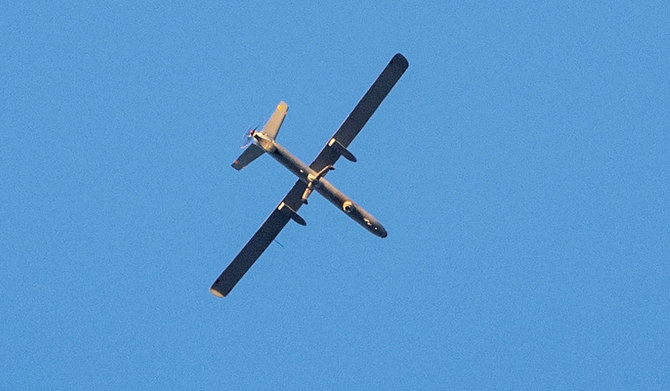 An Israeli army drone flies over the occupied West Bank Jenin refugee camp on November 17, 2023 following an overnight Israeli raid. (AFP)