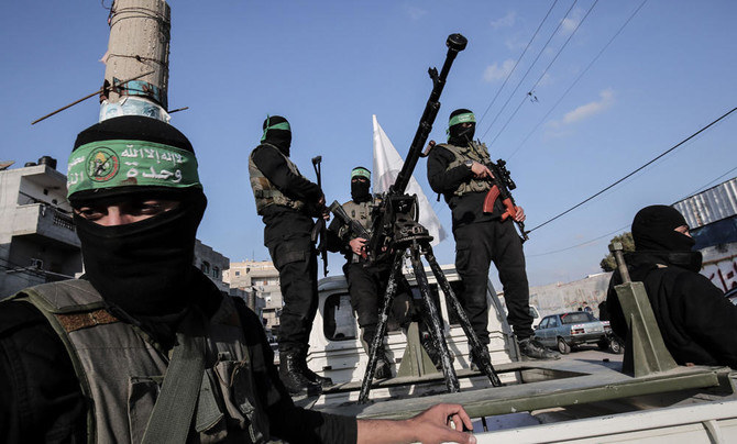 Members of the Ezzedine al-Qassam Brigades, the military wing of the Palestinian Islamist movement Hamas, take part in a rally marking the 29th anniversary of the creation of the movement on December 16, 2016, in Rafah in the southern Gaza Strip. (File/AFP)