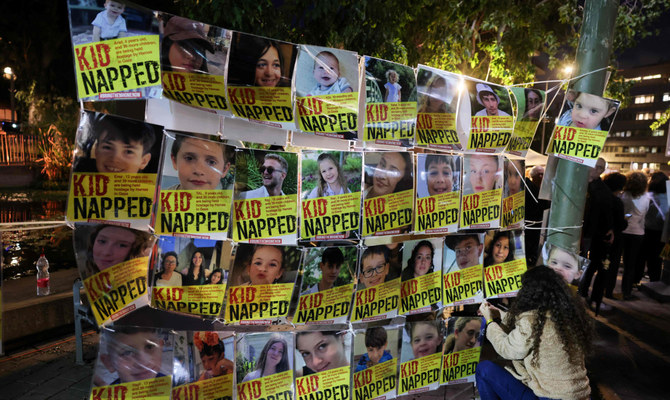 Portraits of Israeli children hostages are displayed during a rally outside the Unicef offices in Tel Aviv on November 20, 2023 to demand the release of Israelis held hostage in Gaza since the October 7 attack by Hamas militants, amid ongoing battles between Israel and the Palestinian armed group. (AFP)