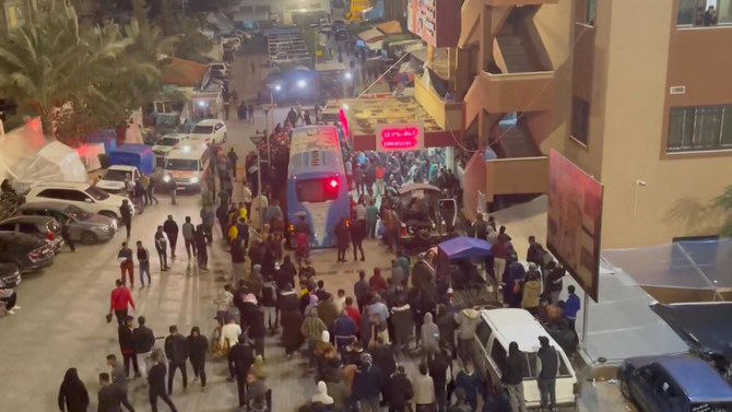 Injured and displaced Palestinians arrive in a bus at Nasser Hospital, in Khan Younis in the southern Gaza Strip in this screengrab from a handout video released on Nov. 21, 2023. (Reuters)
