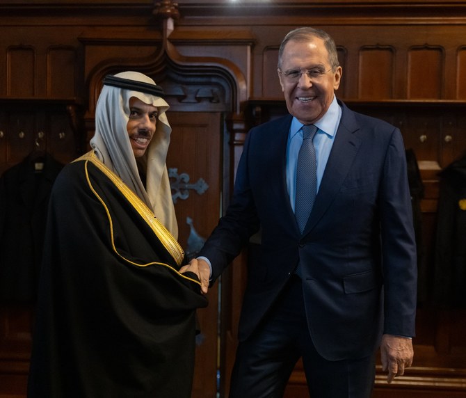 Saudi Arabia’s Foreign Minister Prince Faisal bin Farhan and Russian Foreign Minister Sergey Lavrov shake hands on Tuesday. (SPA)