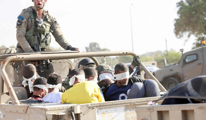 Israel soldiers transfer detained Palestinians out of the Gaza Strip on November 21, 2023, amid ongoing battles between Israel and the Palestinian Hamas movement. (AFP)