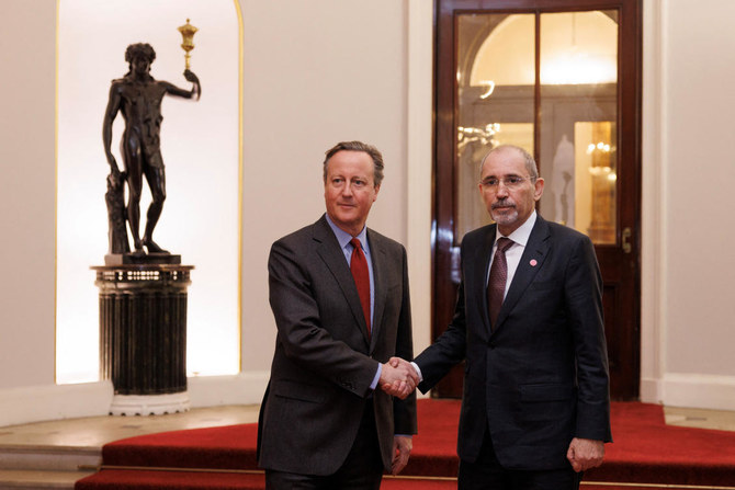 British Foreign Secretary David Cameron greets the Minister of Foreign Affairs of Jordan, Ayman Safadi, as he welcomes Arab and Islamic counterparts to Lancaster House in London on Nov. 22, 2023. (Reuters)