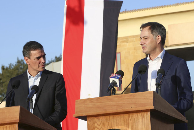 Spanish Prime Minister Pedro Sanchez, left, and Belgian Prime Minister Alexander de Croo speak during a news conference at Rafah crossing to the Gaza Strip, Egypt, as a temporary cease-fire went into effect on Nov. 24, 2023. (AP)