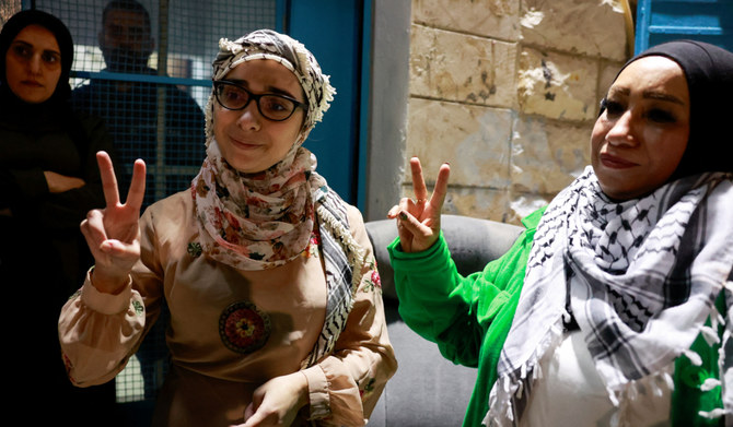 A released Palestinian prisoner gestures as she leaves the Israeli military prison, Ofer, after hostages-prisoners swap deal between Hamas and Israel near Ramallah in the Israeli-occupied West Bank November 24, 2023. (REUTERS)