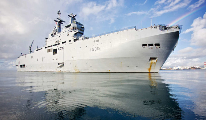 This photograph taken on April 18, 2020 shows the hibious helicopter carrier (PHA) Dixmude arriving in the port of Point-a-Pitre, on the French Carribean archipelago of Guadeloupe. (AFP)