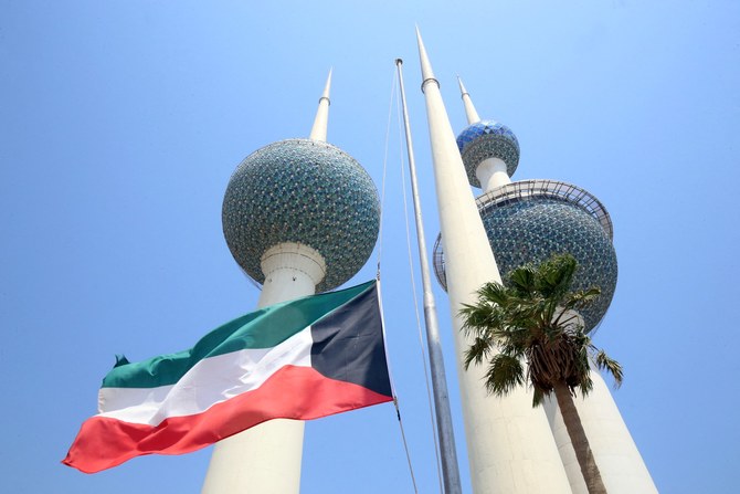The Kuwaiti national flag flies at half-mast in Kuwait City on September 9, 2022, (AFP)