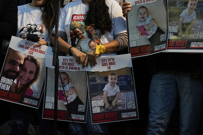 Israeli protesters call for the release of the Bibas family, whose members are being held hostage in the Gaza Strip by the Hamas militant group, in Tel Aviv on Nov. 28, 2023. (AP)