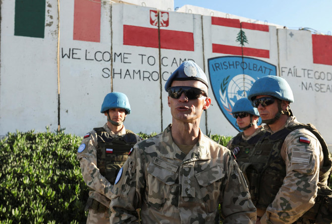 Polish peacekeepers stand together at Camp Shamrock where Irish and Polish peacekeepers of the UNIFIL are stationed near Maroun Al-Ras village close to the Lebanese-Israeli border on Nov. 29, 2023. (Reuters)