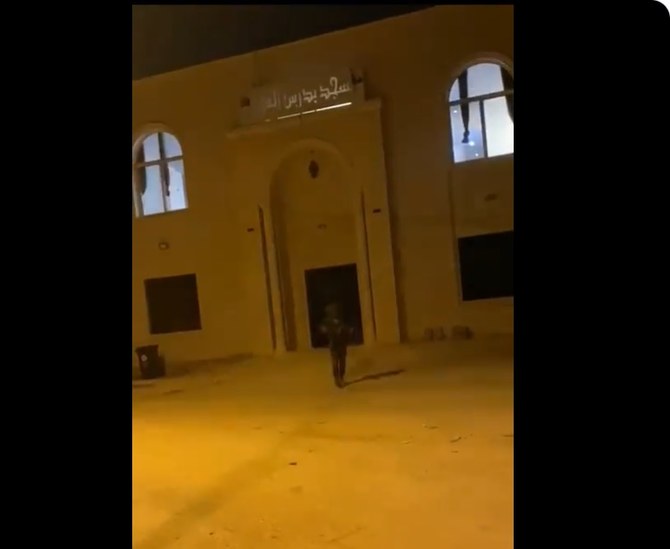 A screengrab taken from a video that shows an IDF soldier asking someone to film him tossing a stun grenade inside the Budrus Grand Mosque in a village in the occupied West Bank. (X/@mobeid)
